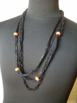 tessuto tubolare nero, filo lurex, catena tessile nera e vaghi arancio fluo 12 euro